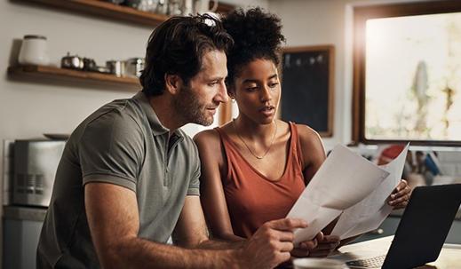 Couple reading papers.