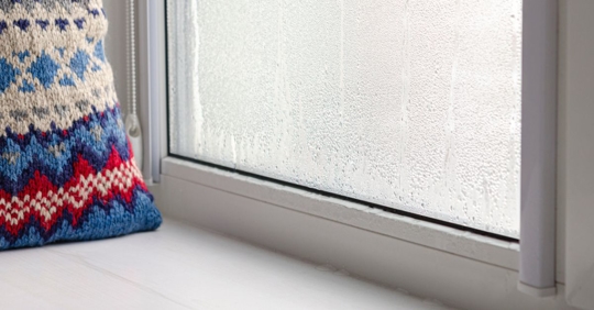 Condensate droplets on the glass of the metal-plastic window